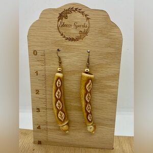 Vintage handmade dangle earrings with leaf accents